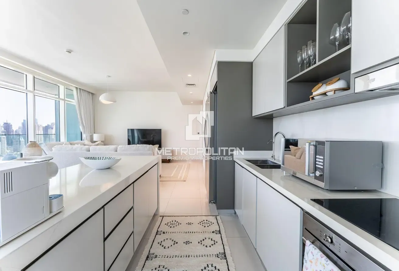 Top Floor Unit | Turnkey | Marina and Palm View
