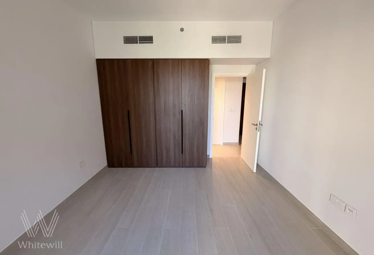 Bright Unfurnished Apartment with Community View