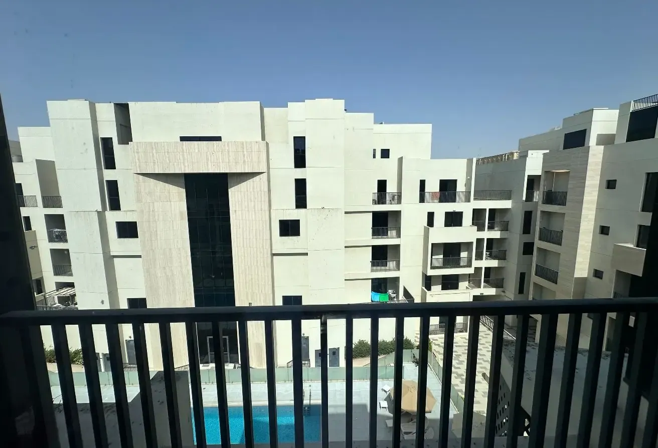 2BR Apartment in Mirdif with Balcony and Pool View