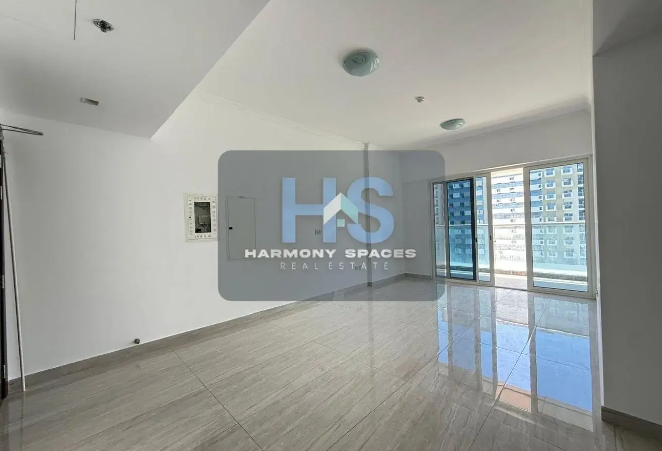 Neutral white walls | Community & road view | 2BR