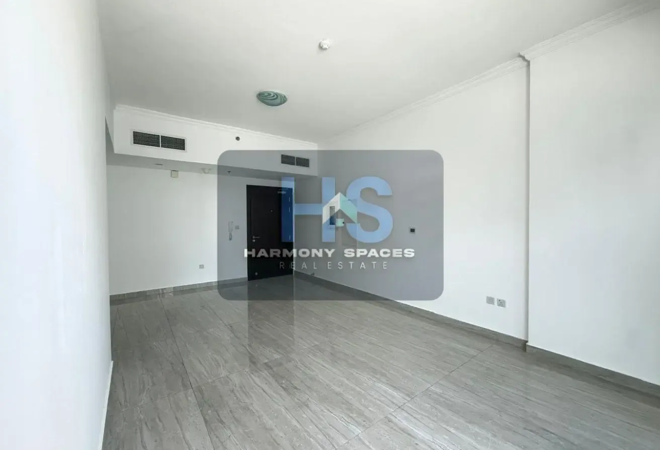 Neutral white walls | Community & road view | 2BR