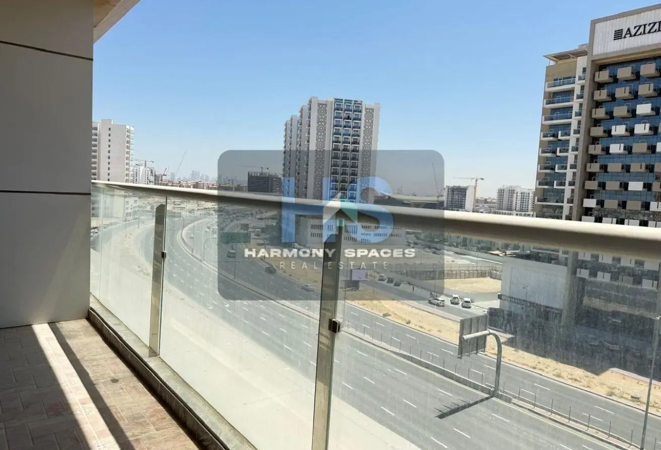 Neutral white walls | Community & road view | 2BR