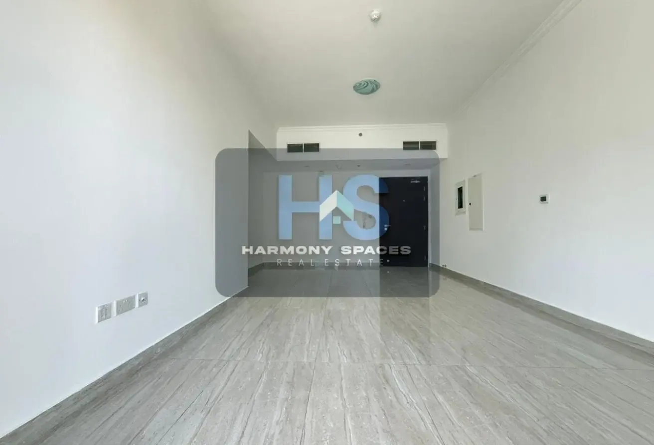 Neutral white walls | Community & road view | 2BR