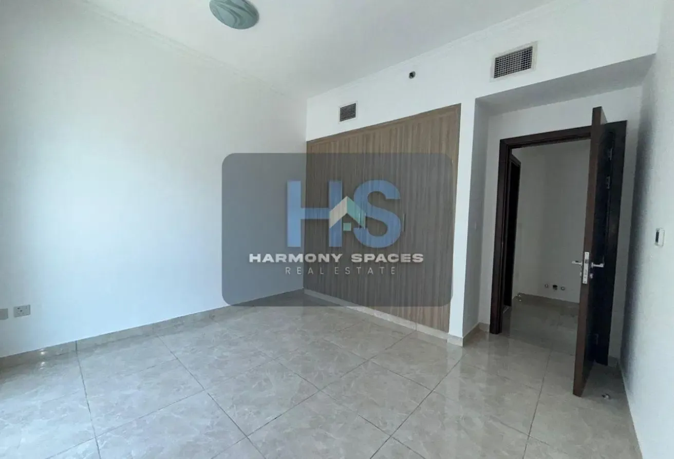 Neutral white walls | Community & road view | 2BR