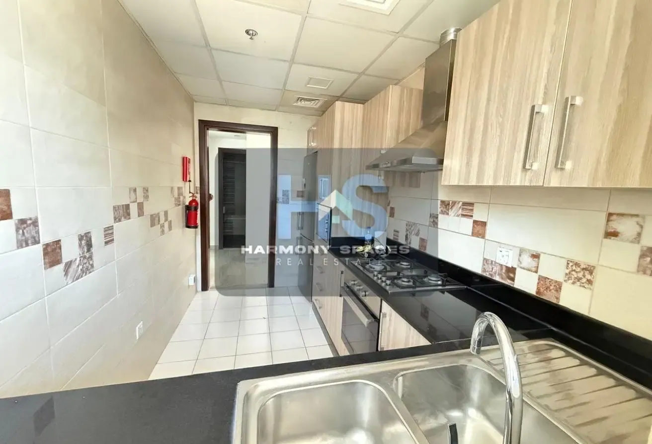 Neutral white walls | Community & road view | 2BR