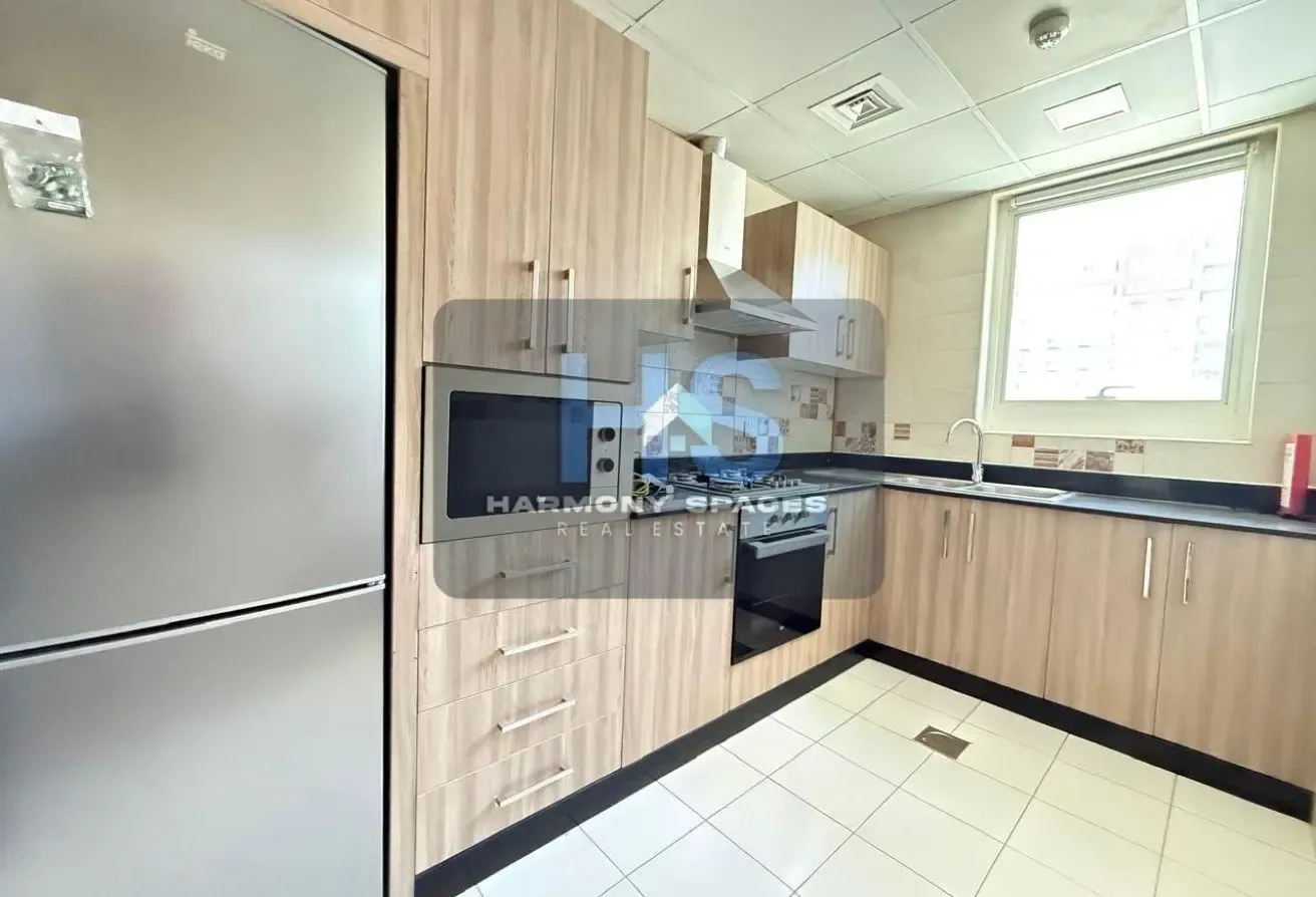 Neutral white walls | Community & road view | 2BR
